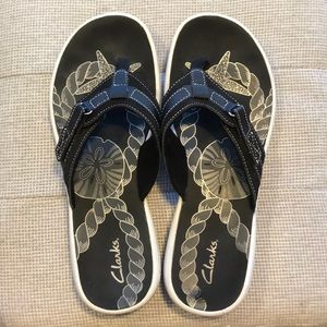 Clark’s flip flops